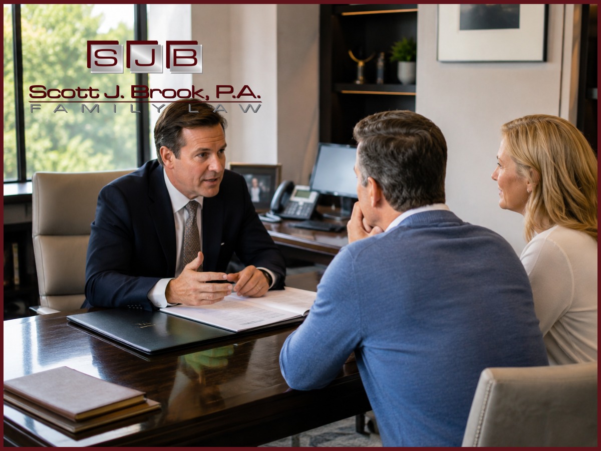 Family law attorney reviewing financial documents with a client during an alimony consultation in Boca Raton, Florida.